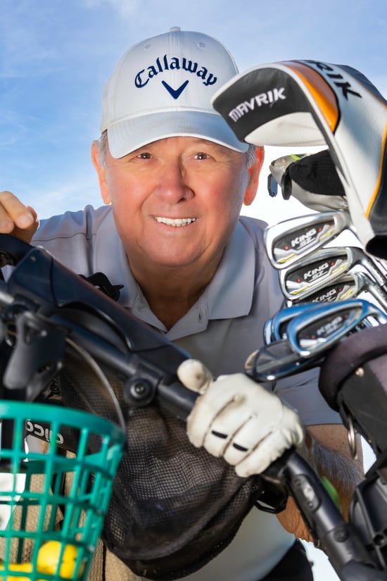 Doug next to his golf clubs